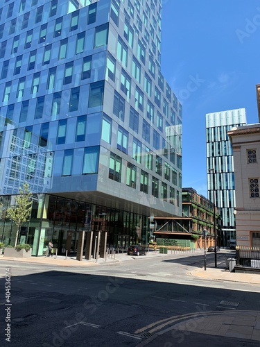 Modern buildings in Manchester City centre. Clear blue sky background. 