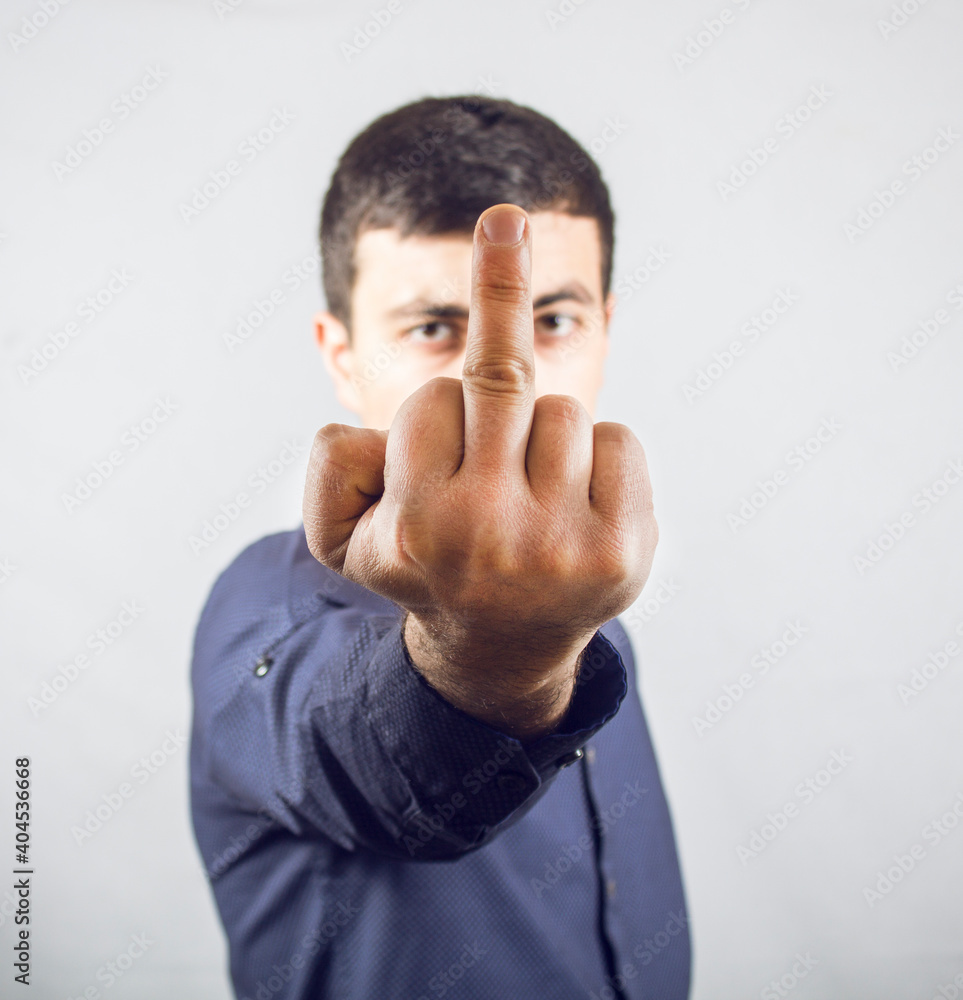 guy shows middle finger Stock Photo | Adobe Stock