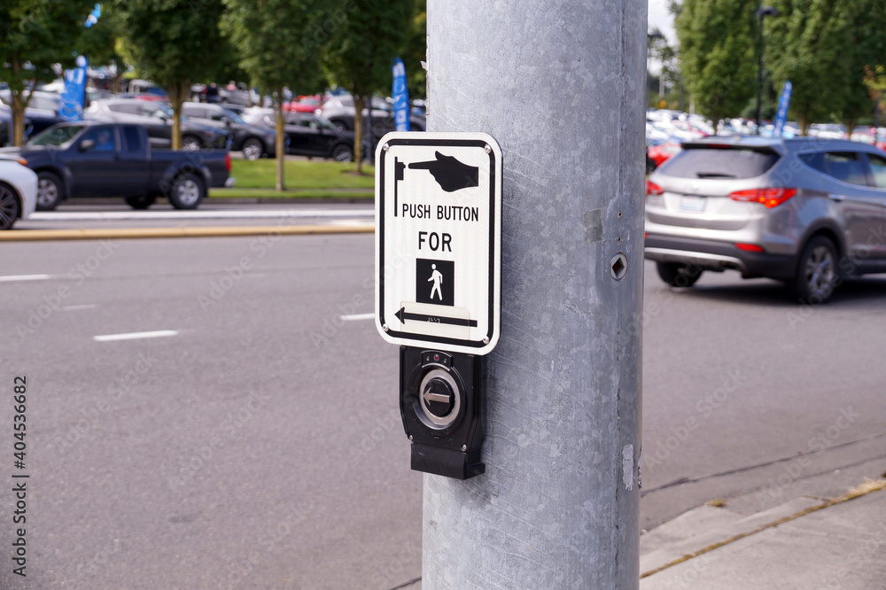 Crossroads. A steel pole with a switch for pedestrians. Crossroads. A steel pole with a switch for pedestrians.