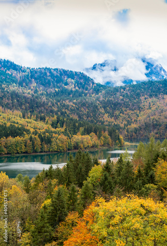 A view of Bavarian Alps, storm sky nnd lake in autumn