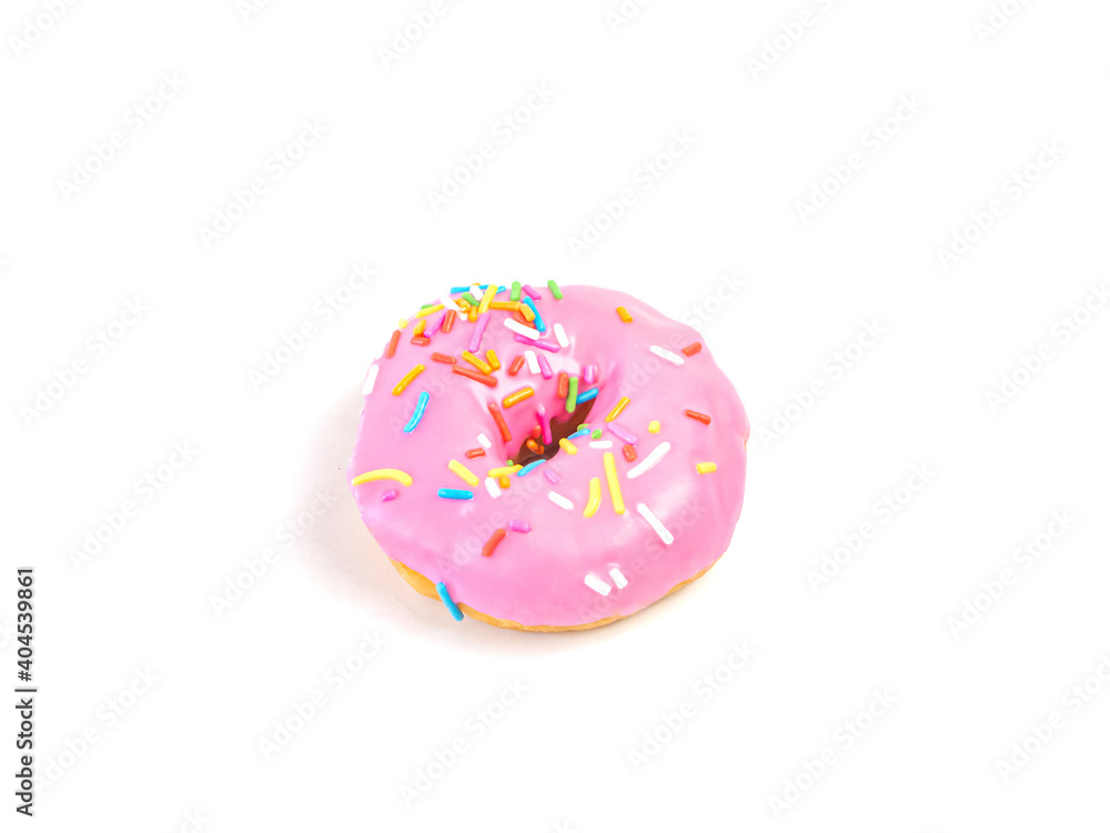 Strawberry flavoured donut with sprinkles on white background. One pink doughnut isolated picture. Homemade bakery concept. Strawberry flavoured donut with sprinkles on white background. One pink doughnut isolated picture. Homemade bakery concept.