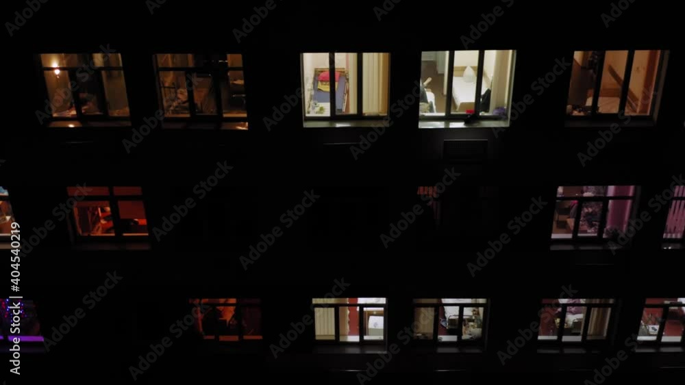 Hospital building exterior with the observation wards (sickrooms). Aerial view from outside at night. Hospital building exterior with the observation wards (sickrooms). Aerial view from outside at night.