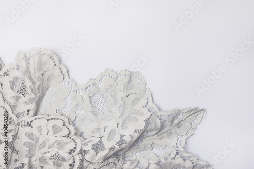 Light Green Lace cloth on Blue Background Horizontal Top View Copy Space