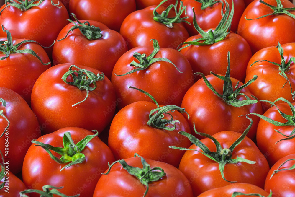 Vegetable background from juicy and ripe tomatoes. Vegetable background from juicy and ripe tomatoes.