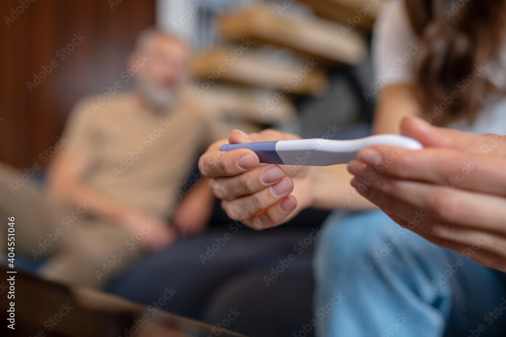Woman looking looking at the pregnancy test