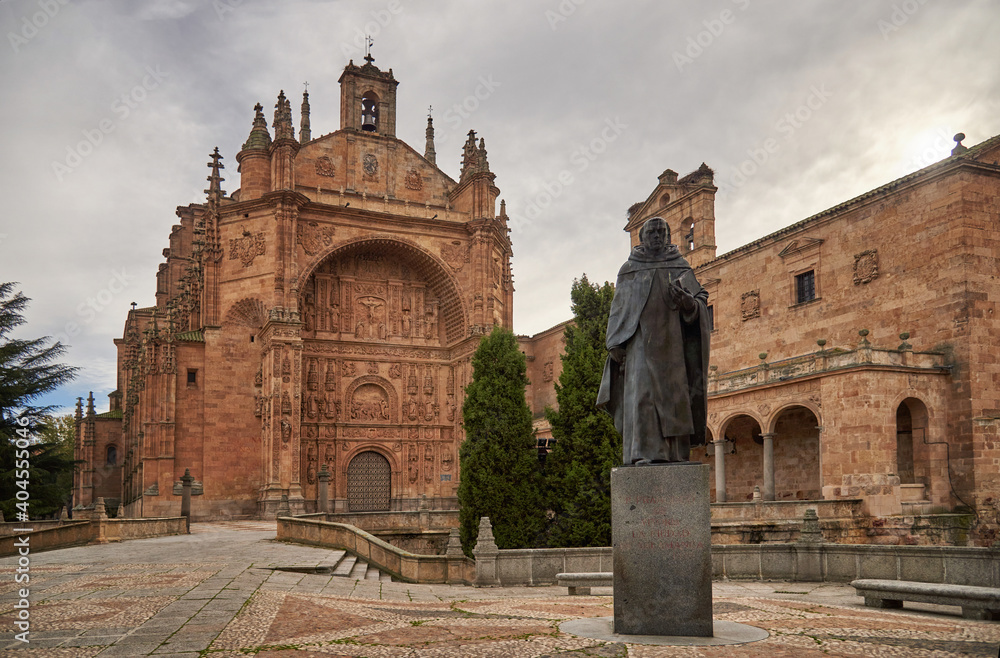Facade of the Convent of San Esteban and honorary statue to Francisco e Vitoria, from the city of Salamanca, Castilla y León, Spain, photograph taken in winter 2020 (December-January)