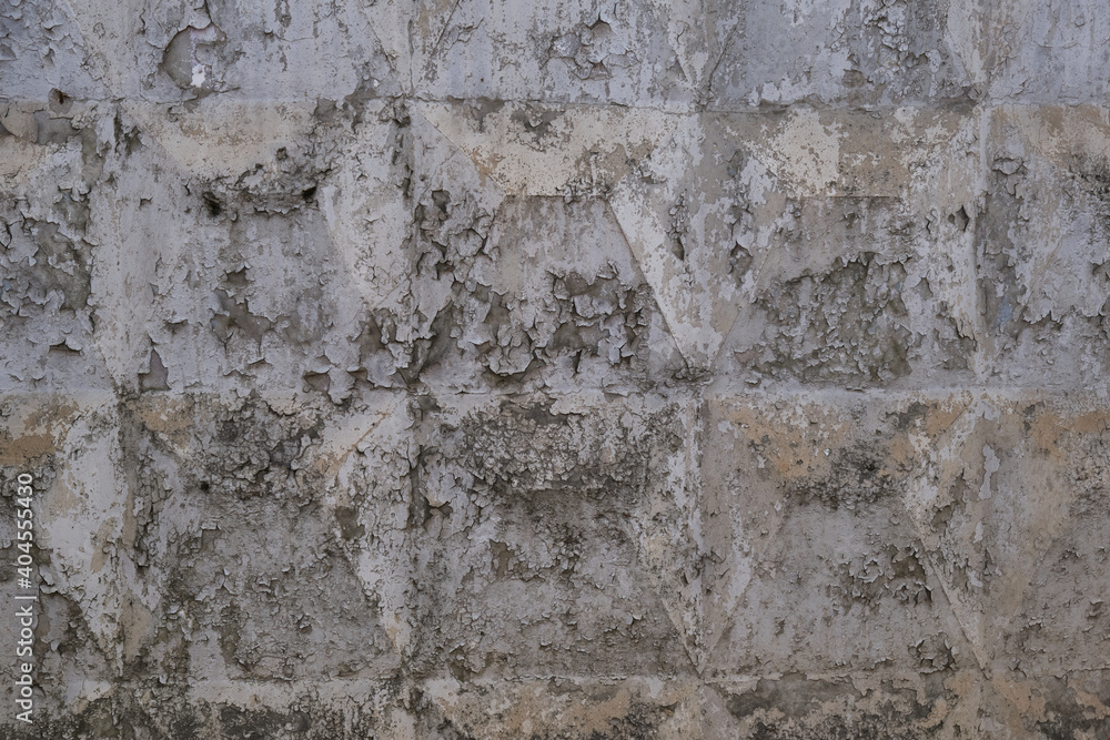 Peeling old paint on a concrete wall. Abstract background. Space for lettering or design Peeling old paint on a concrete wall. Abstract background. Space for lettering or design