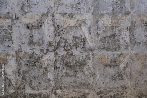 Peeling old paint on a concrete wall. Abstract background. Space for lettering or design