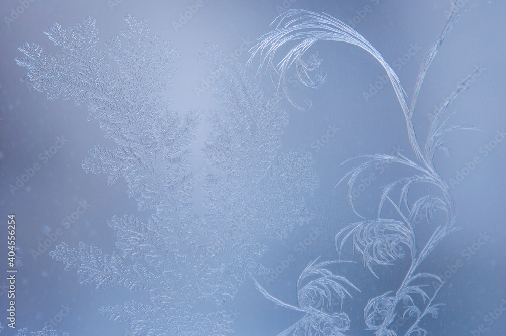 Frosty patterns on the edge of a frozen window. Frosty patterns on the edge of a frozen window.