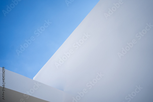 White building corner with clear sky