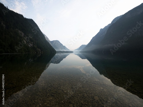 Panorama reflection of alpine mountain lake Konigssee Koenigssee King Schonau Berchtesgaden Bavaria Germany alps photo