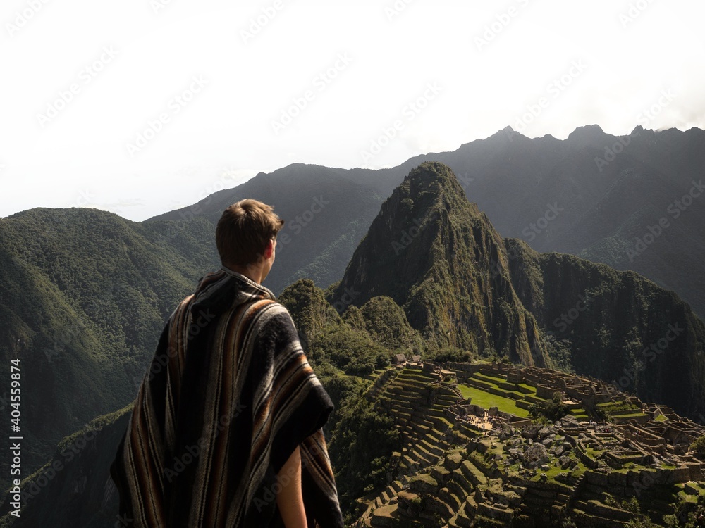 Φωτογραφία Tourist person man in traditional poncho costume at Machu Picchu inca citadel hi