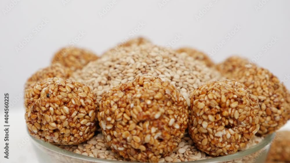 Sesame ladoos filled in a bowl, Micro shot of sesame seeds in a bowl Sesame ladoos filled in a bowl, Micro shot of sesame seeds in a bowl