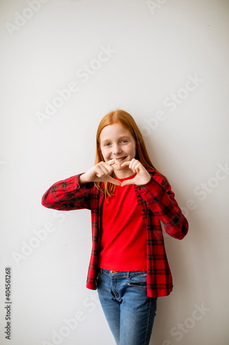 Cute little red hair girl s...