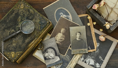  Still-life with old photo album and historical photos of family