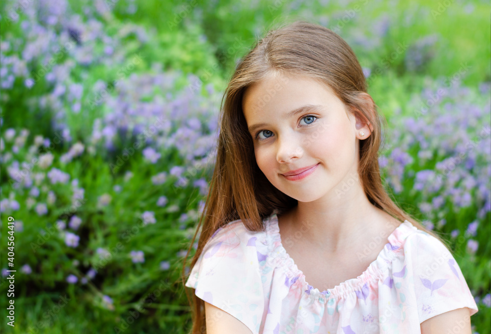 Portrait of adorable smiling little girl child in summer day. Happy preteen in the park Portrait of adorable smiling little girl child in summer day. Happy preteen in the park