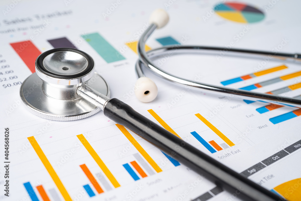 Stethoscope on charts and graphs paper, Finance, Account, Statistics, Investment, Analytic research data economy and Business company concept. Stethoscope on charts and graphs paper, Finance, Account, Statistics, Investment, Analytic research data economy and Business company concept.
