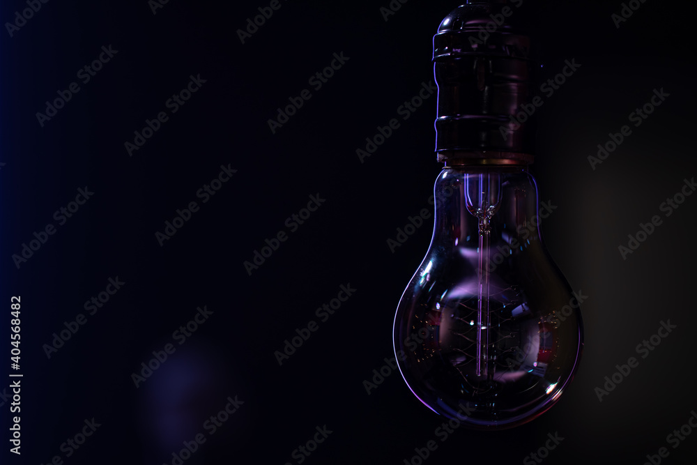 Close up of a non-burning lamp on a blurred dark background. Close up of a non-burning lamp on a blurred dark background.