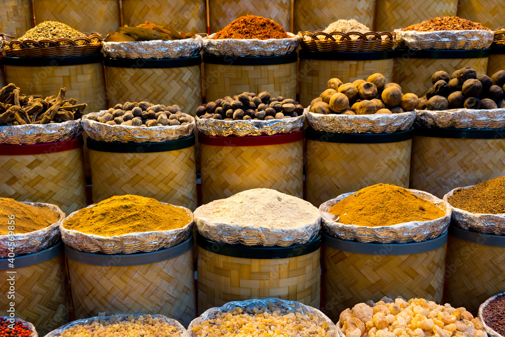 Variety of colorful Arabic spices and herbs on the arab street market stall. Dubai Grand Spice Souk, United Arab Emirates.