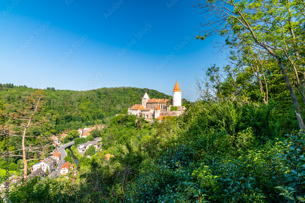 Panorama view of medieval castle Krivoklat, Czech Republic. Sunny day during summer, fresh forest near the castle.