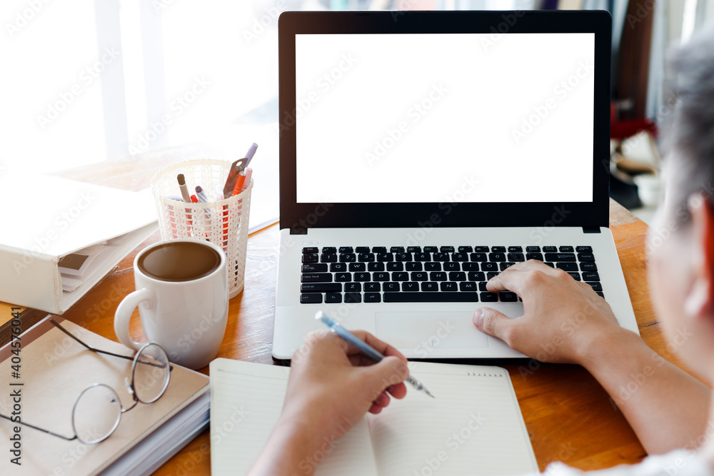 Mockup Copy Space Computer Notebook Laptop Concept , a man's hand using a laptop on internet websites at the office, keyboards on laptop computer with balnk copy screen for your advertising content. Mockup Copy Space Computer Notebook Laptop Concept , a man's hand using a laptop on internet websites at the office, keyboards on laptop computer with balnk copy screen for your advertising content.
