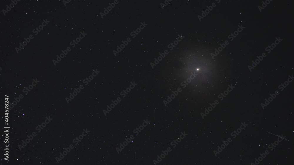 Timelapse of the movement of Mars in the night sky among the clouds Timelapse of the movement of Mars in the night sky among the clouds