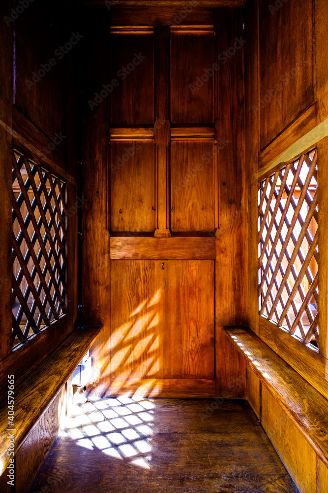 Φωτογραφία typical old confession booth at a church