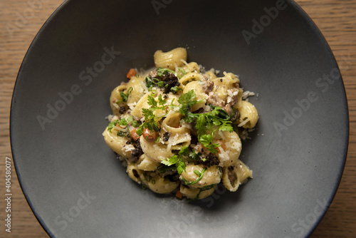 Lumache pasta with short rib and black truffle photo