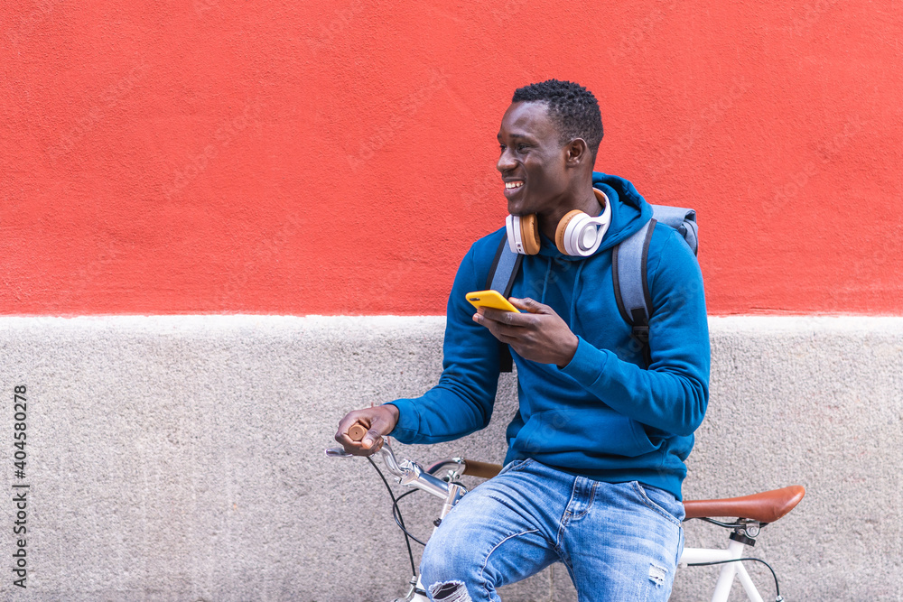 Photography Black Man Holding Skateboard Using Cellphone Wearing Blue Sweater Outdoors