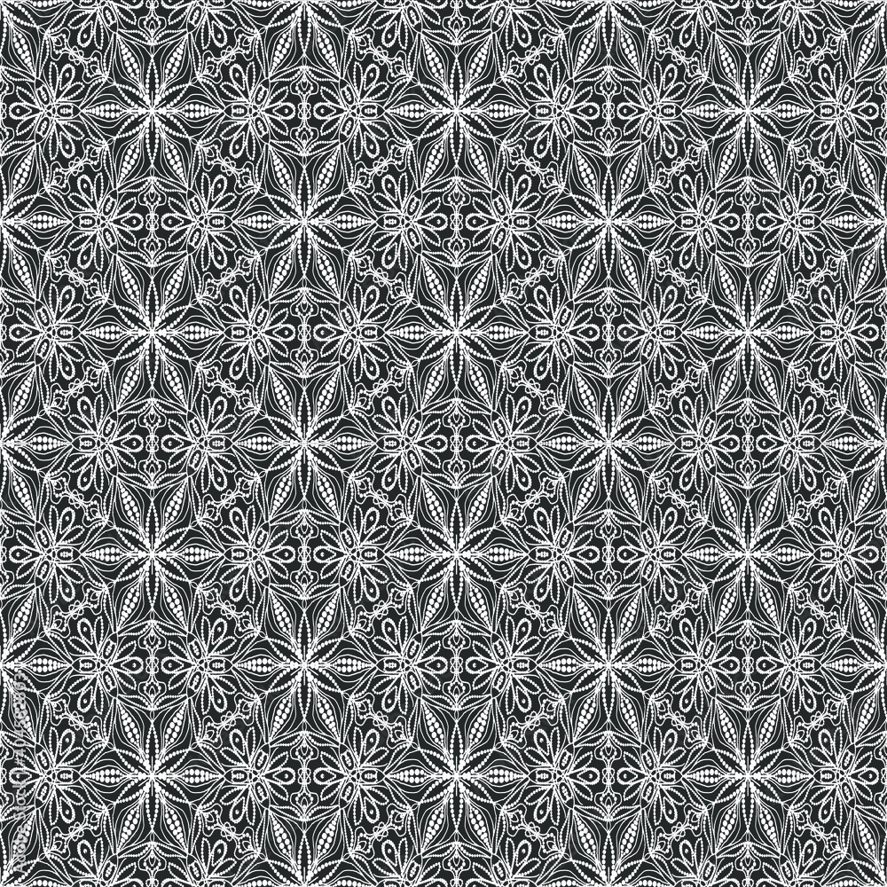 Fototapeta premium Lacy white ornament on a black background. Print on fabric and paper. Seamless pattern