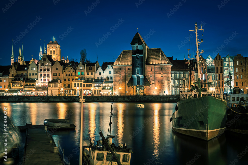 Historic old town and historic port crane in Gdansk in the evening time, Poland