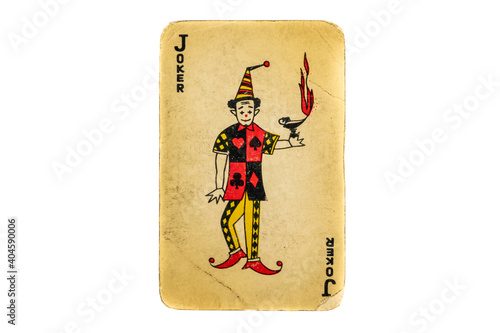 Fototapeta old damaged joker card on white background
