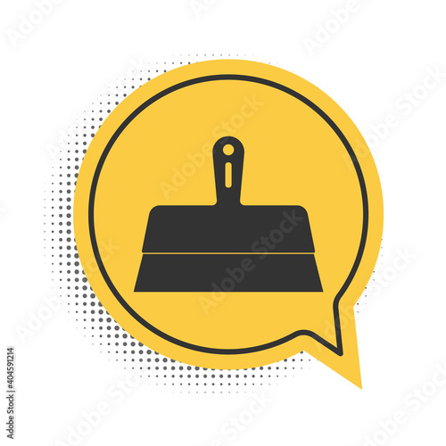 Black Putty knife icon isolated on white background. Spatula repair tool. Spackling or paint instruments. Yellow speech bubble symbol. Vector.