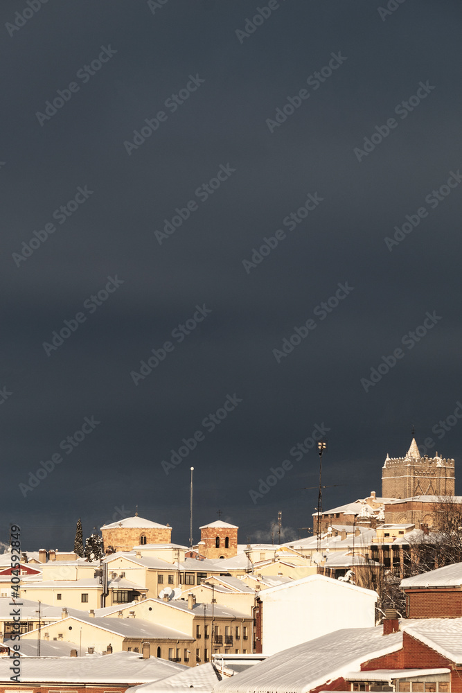 Fototapeta premium Snowed roofs at sunrise, after a blizzard