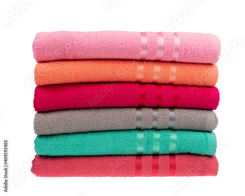 stack of colorful towels isolated on white.