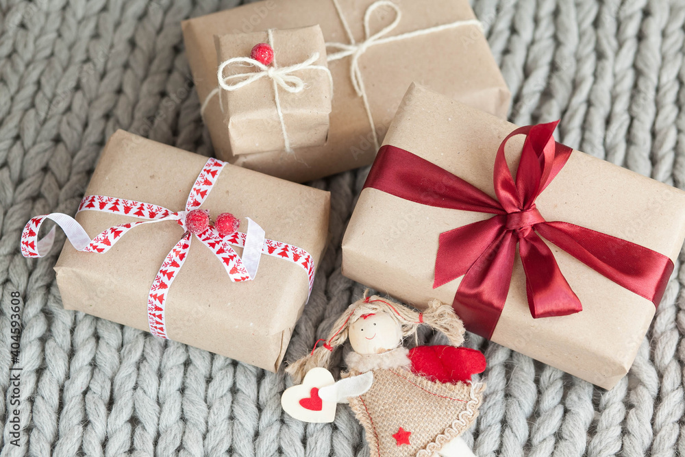 Gift boxes with ribbons on a handmade knitted cozy background. Valentine's Day presents. Happy Birthday. Love consept.
Gift boxes with ribbons on a handmade knitted cozy background. Valentine's Day presents. Happy Birthday. Love consept.