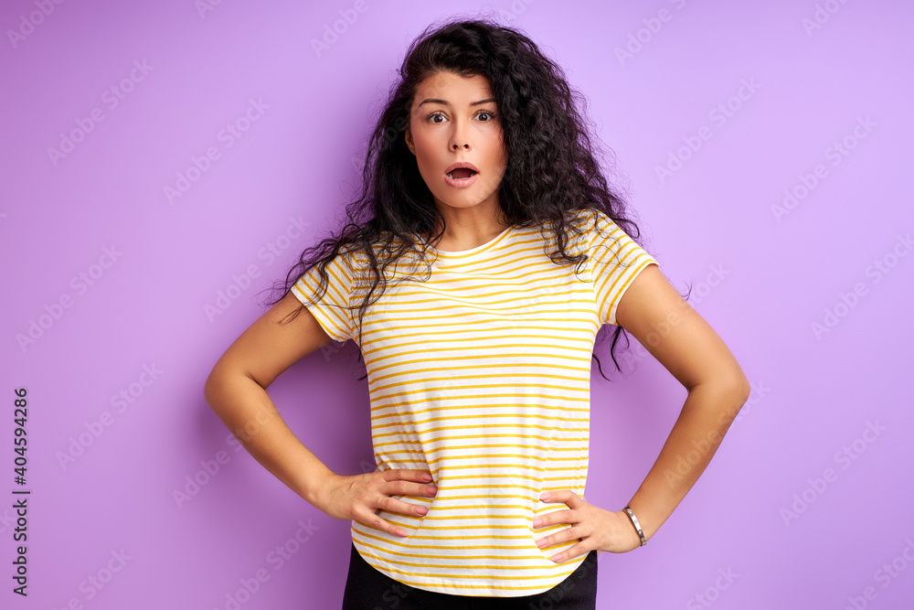 woman stand with wide opened mouth isolated on purple background woman stand with wide opened mouth isolated on purple background