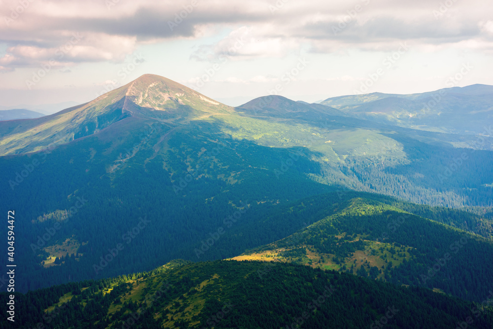 hoverla peak of carpathian black ridge. beautiful summer landscape at noon. clouds on the sky above the valley. view from petros mountain slope covered in grass