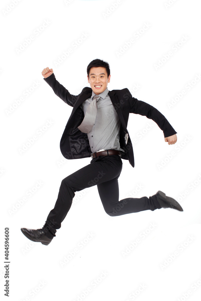 A happy young Business man Jumping up A happy young Business man Jumping up