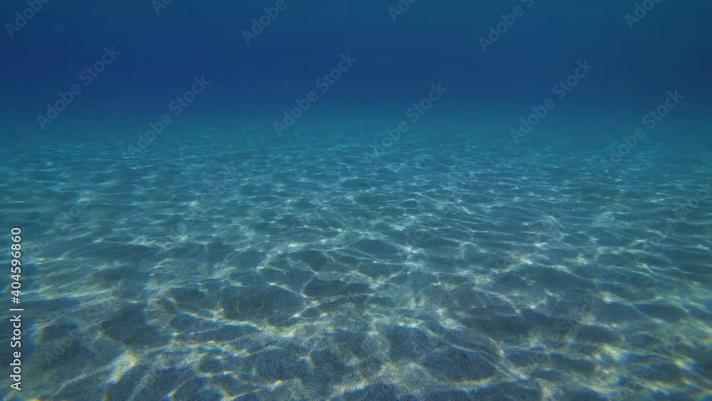 The rapid movement of sunlight on a sandy bottom. The rapid movement of sunlight on a sandy bottom.