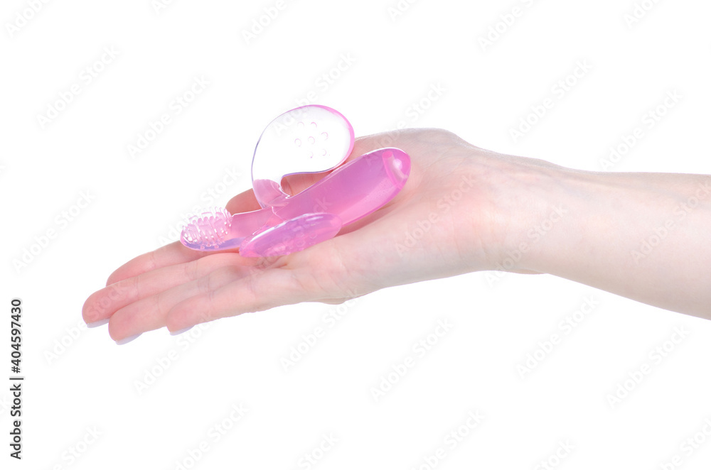 Teether massager banana in hand on white background isolation Teether massager banana in hand on white background isolation