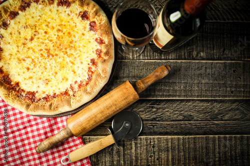 Traditional Brazilian pizza, vegetables, ingredients on a dark aged wooden background. Space for text.
