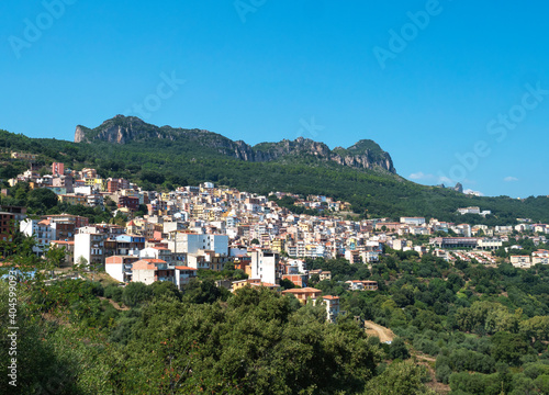 Cityscape of old pictoresque colorful village Jerzu with limestone rocks, mountains and green forest vegetation. Summer sunny day. Province of Nuoro, Sardinia, Italy, Europe © Kristyna