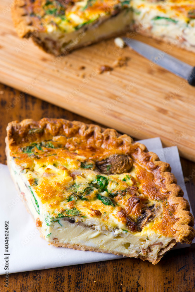 Quiche. Farm fresh eggs mixed with spinach, bacon, ham, sausage, cheese, vegetables poured in a pie crust and baked. Classic American restaurant or French Bistro breakfast or brunch favorite.