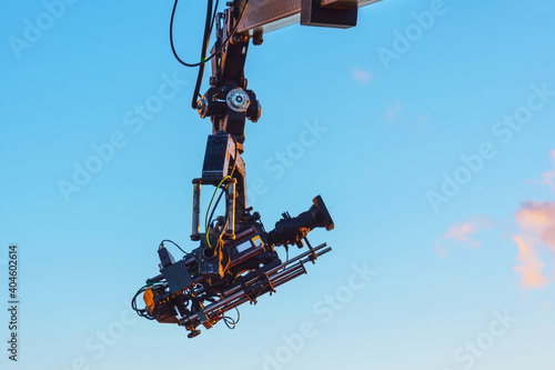 TV camera on a crane on at a public mass event.