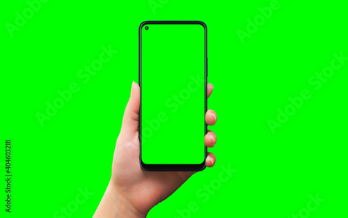 Phone in woman hand isolated in chroma key green