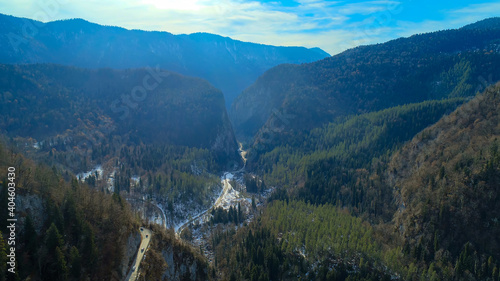 Ritsa Relict National Park. Observation Deck Farewell Homeland. Abkhazia. Aerial view drone. valley of snow-capped mountains, many trees on slope. cornice chabgarskiy photo