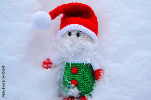 Wallpaper Mural A little gnome in a red riding hood on white snow Torontodigital.ca