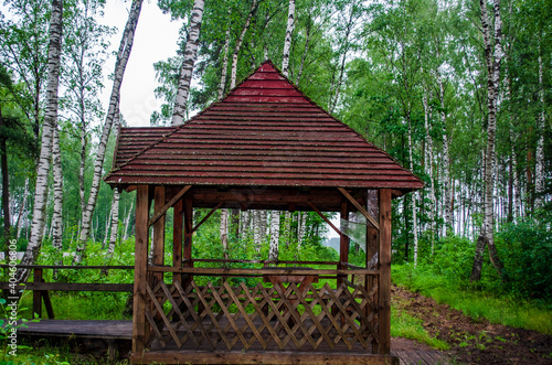 wooden gazebo in the park © Сергей Семенов