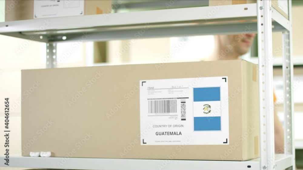 Cardboard box from Guatemala and warehouse worker Cardboard box from Guatemala and warehouse worker